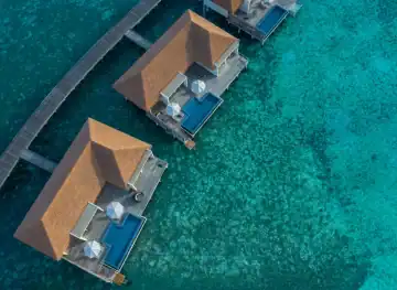 Three Bedroom Overwater Villa - Pool and Lagoon View / Three Bedroom Overwater Villa - Pool and Sunset View